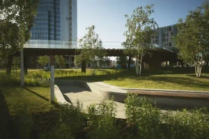 Urban business park showing what is commercial landscaping with green spaces, walkways, and modern outdoor design